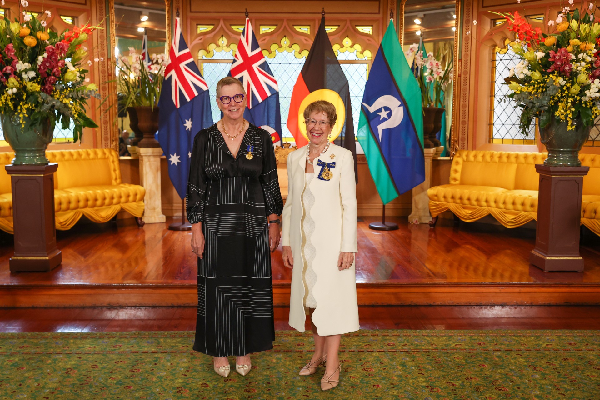 Award presentation in formal setting.