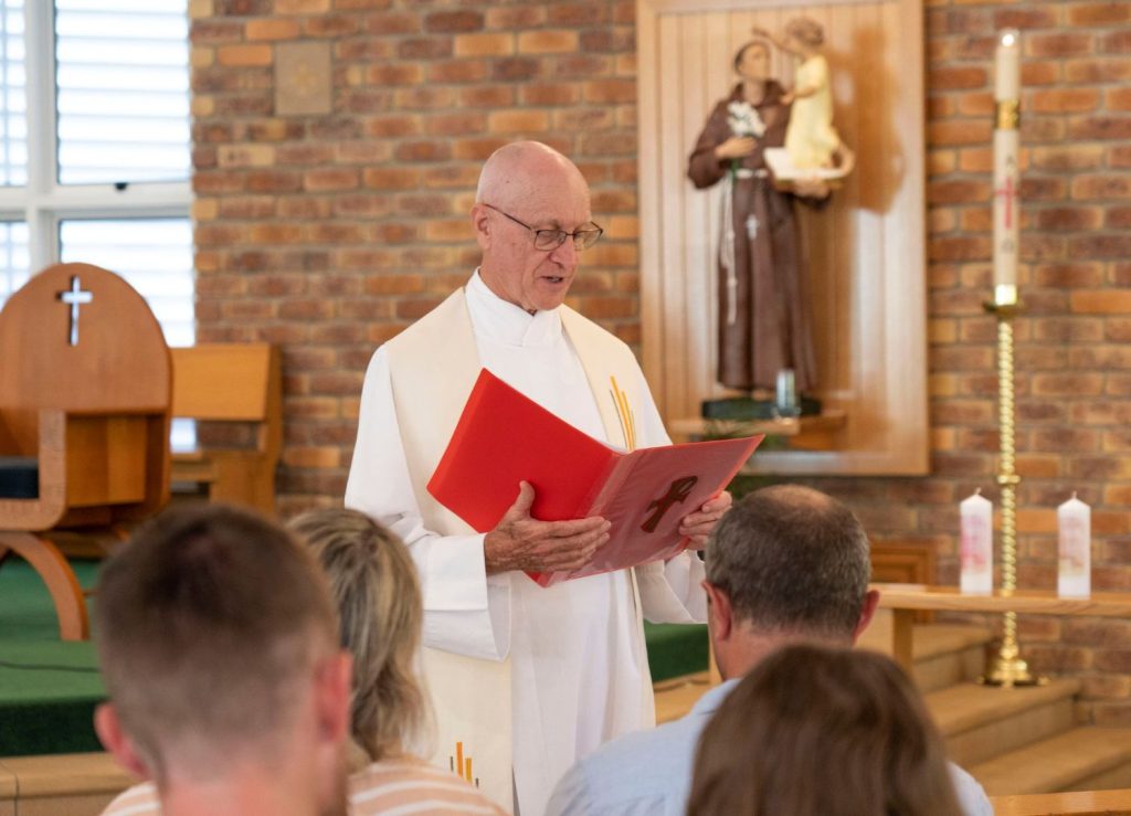 Clergy member leading a service.